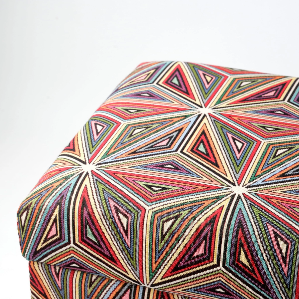 Colourful pouffe with floral motif and storage compartment, upholstered, on dark legs