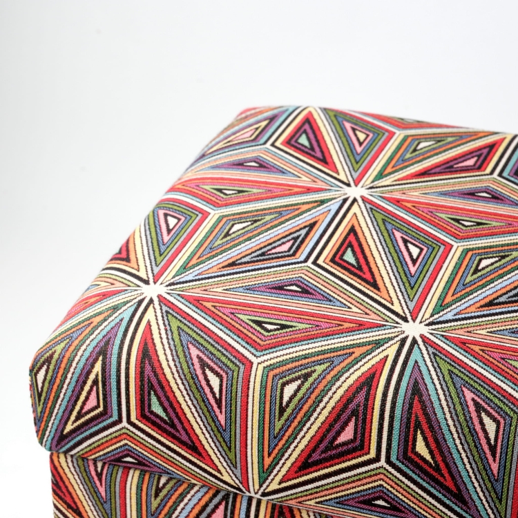 Colourful pouffe with floral motif and storage compartment, upholstered, on dark legs
