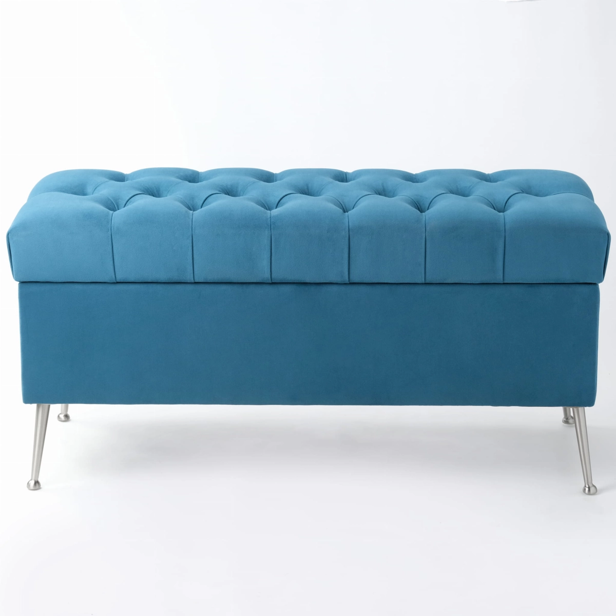 Modern blue quilted pouffe with storage, standing on metal legs