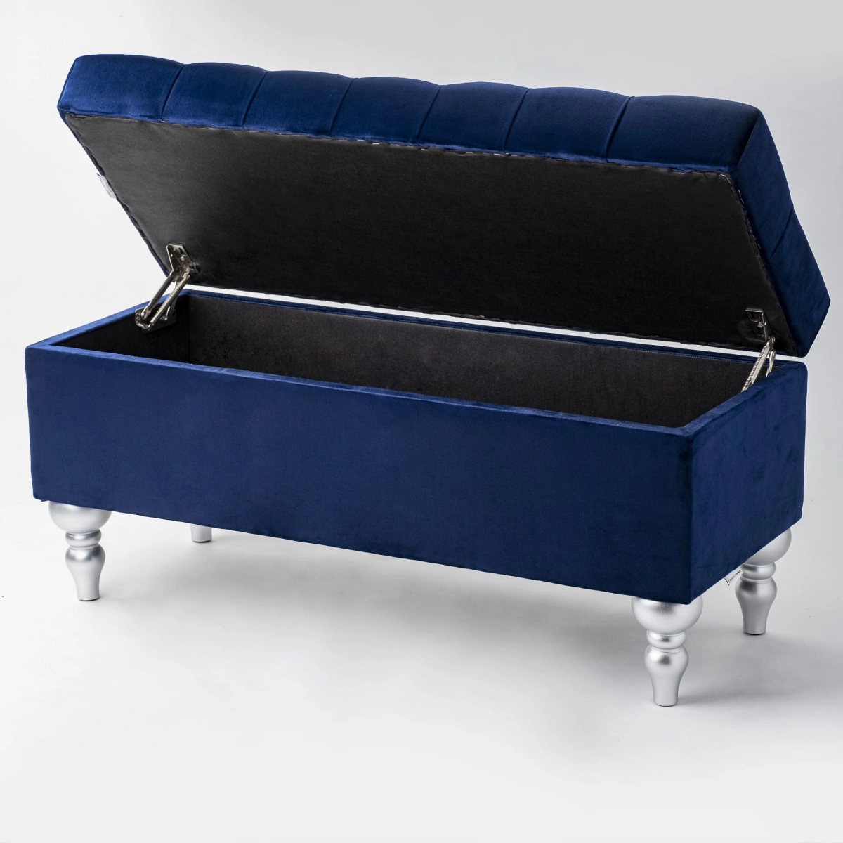 Quilted pouffe in navy blue with storage compartment, a stylish and roomy accessory