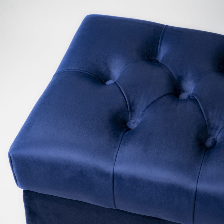 Stylish quilted navy blue pouffe with storage compartment