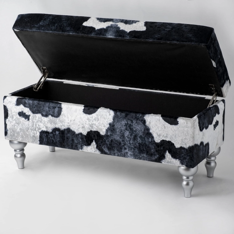 Upholstered pouffe with storage in cow motif