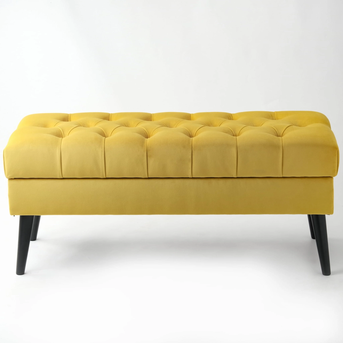 Stylish quilted chest in honey colour, a practical piece of furniture for the interior