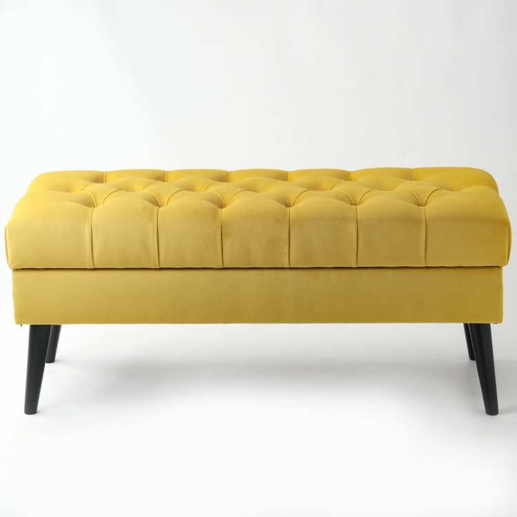Stylish quilted chest in honey colour, a practical piece of furniture for the interior