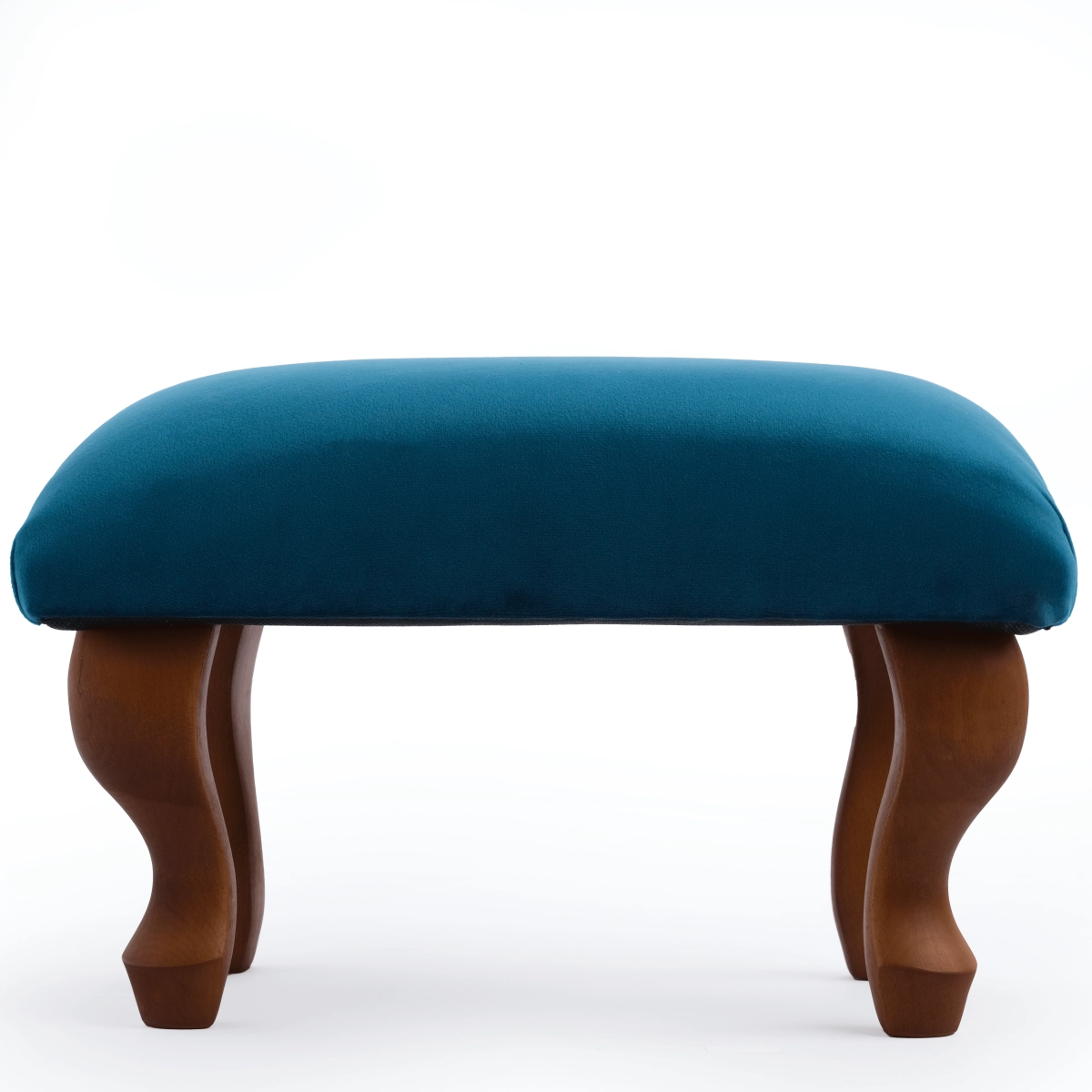 Upholstered footstool in blue, an elegant and practical interior element