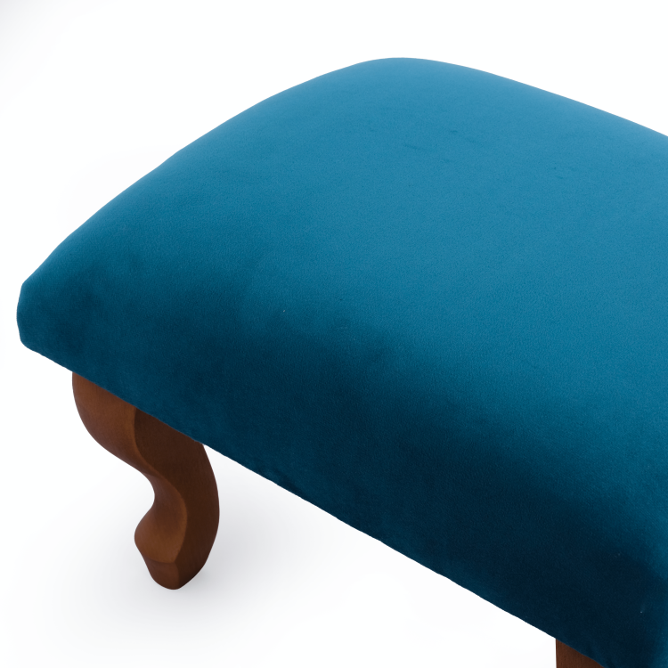 Stylish blue upholstered footstool, comfort and aesthetics in one