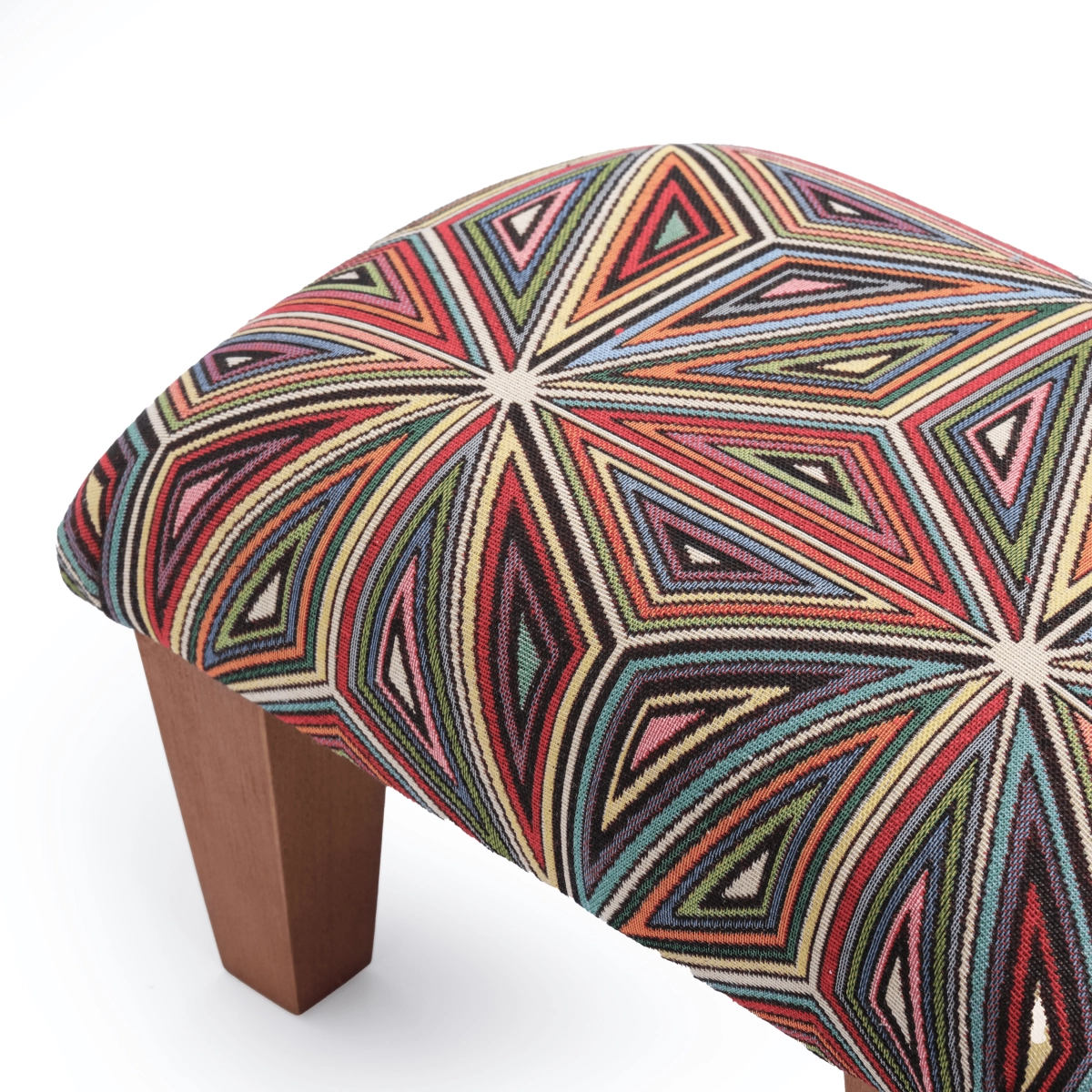 Armchair footstool in bright colours, a comfortable and decorative piece of furniture
