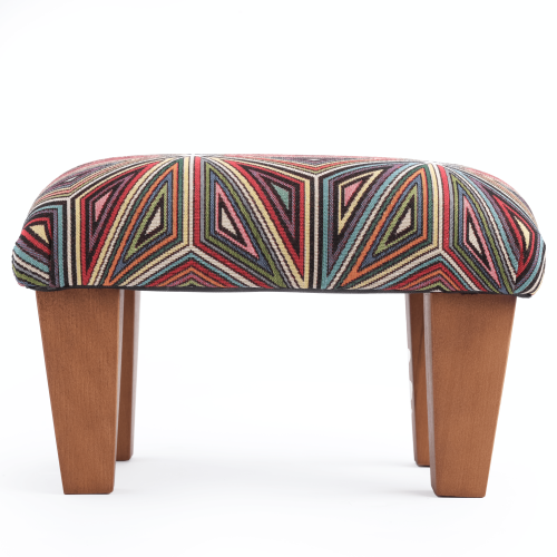 Comfortable armchair footrest in coloured upholstery, original design
