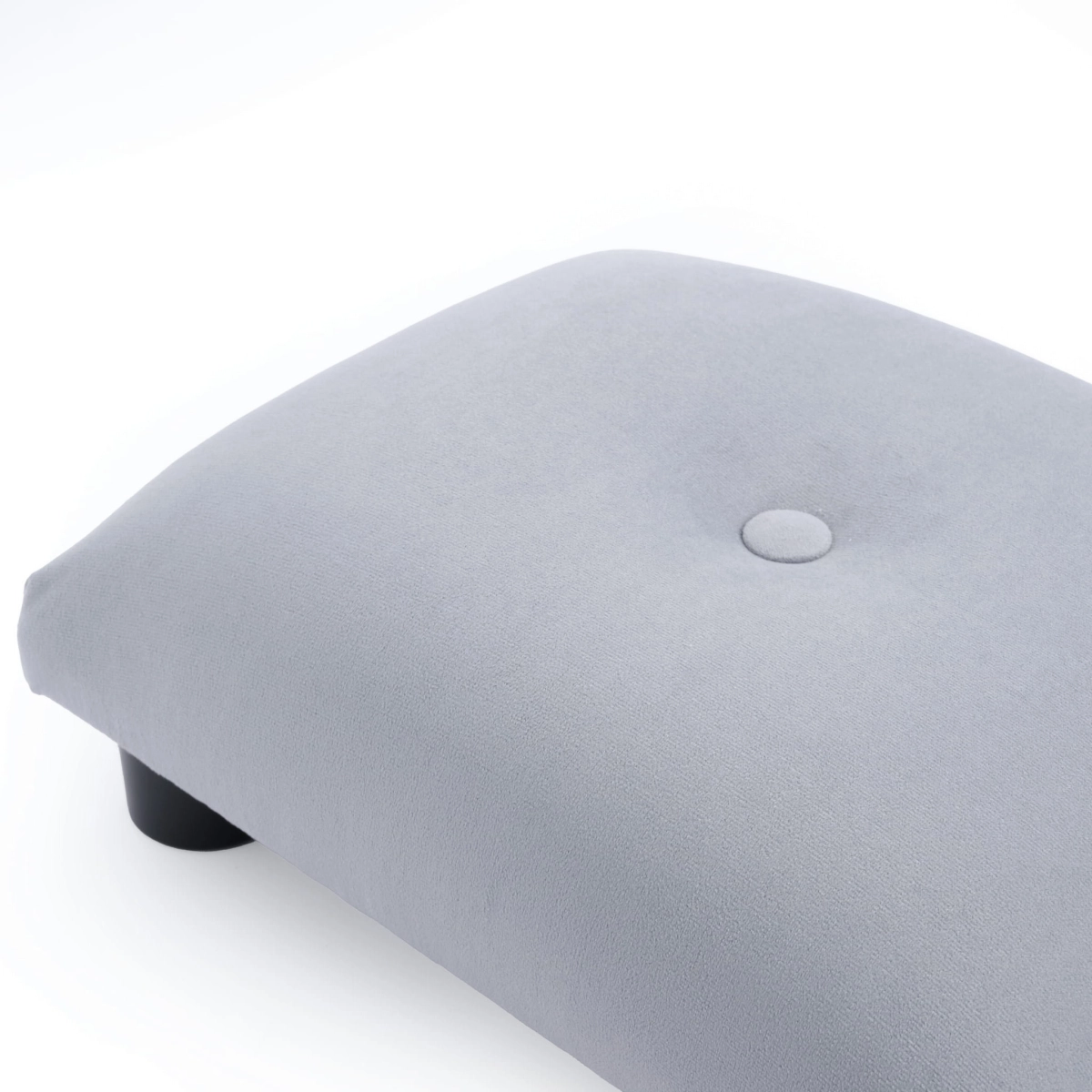 Soft grey quilted footstool, a practical and aesthetically pleasing piece of furniture