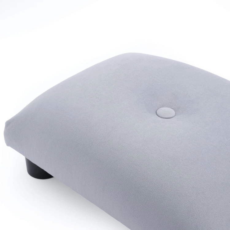 Soft grey quilted footstool, a practical and aesthetically pleasing piece of furniture