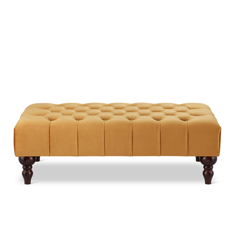 Papaya-colored quilted coffee table with leather upholstery, a modern and stylish piece of furniture for the living room