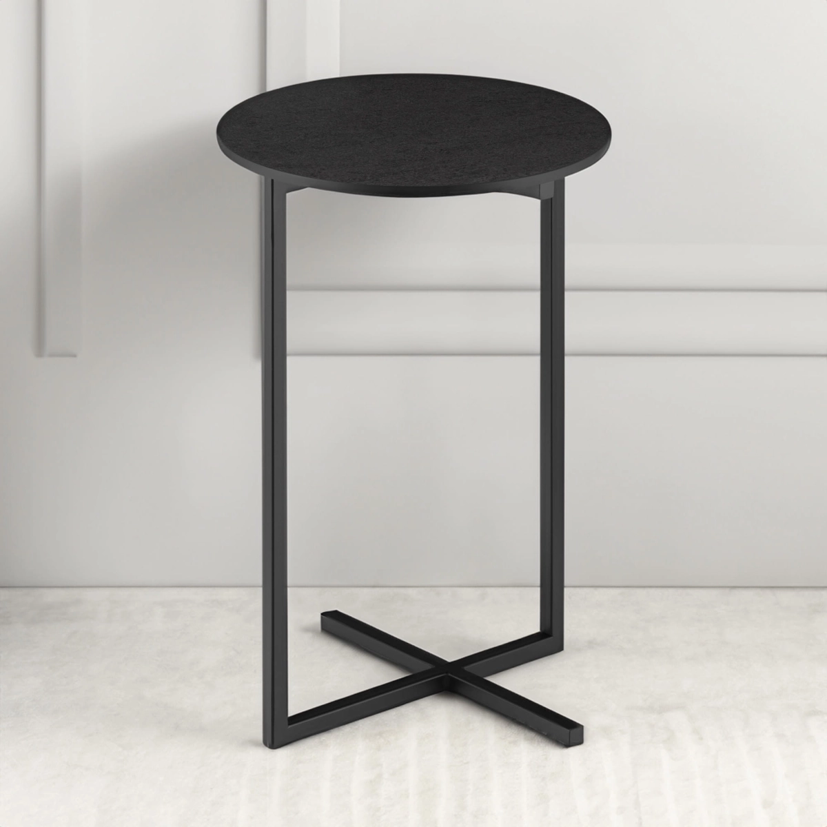 Black round side table with steel base
