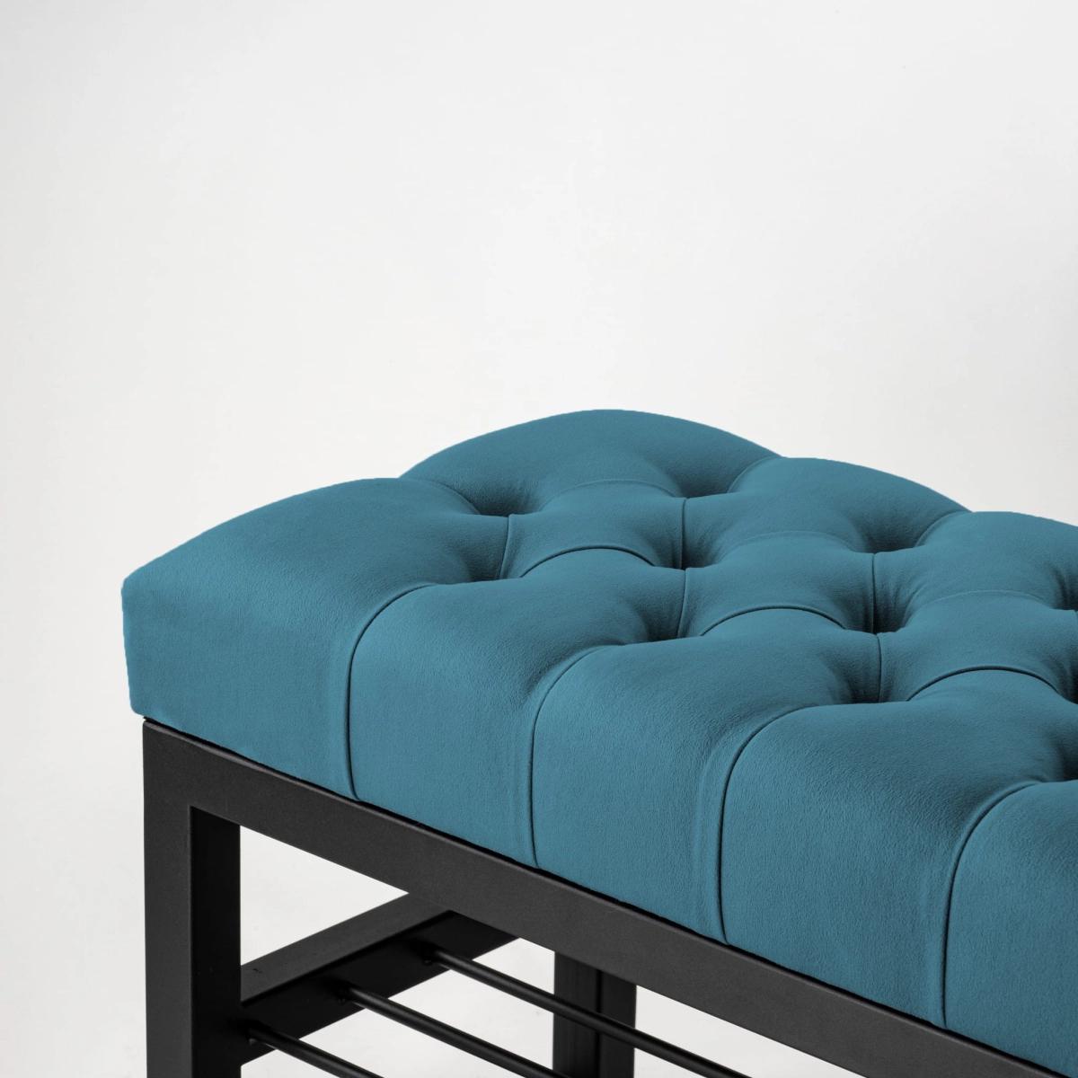 Bench in blue with quilting and steel structure with shelves