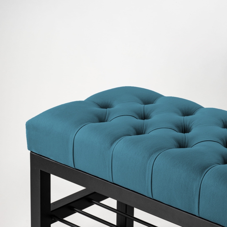 Bench in blue with quilting and steel structure with shelves
