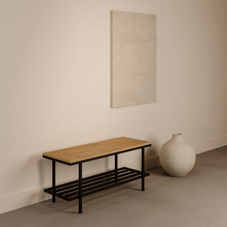 Industrial style bench with wooden top on steel base in the hallway