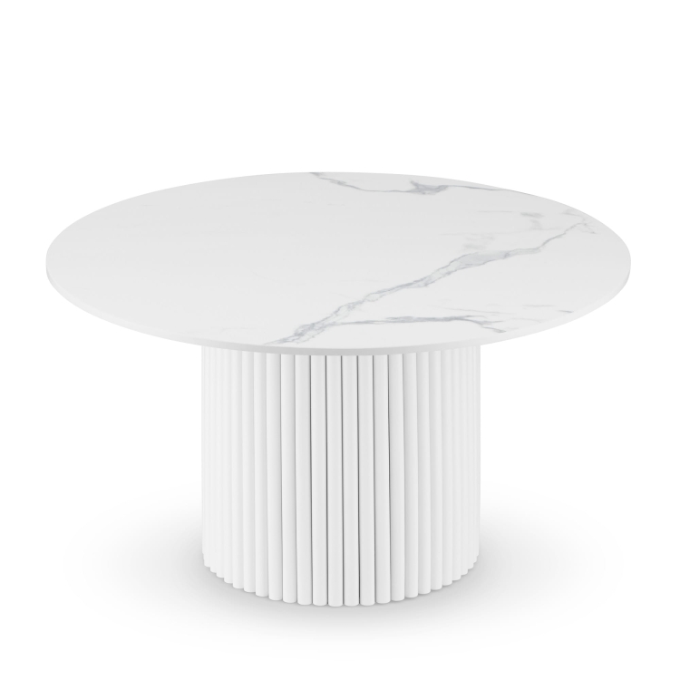 Round white table with stone top and decorative grooved base