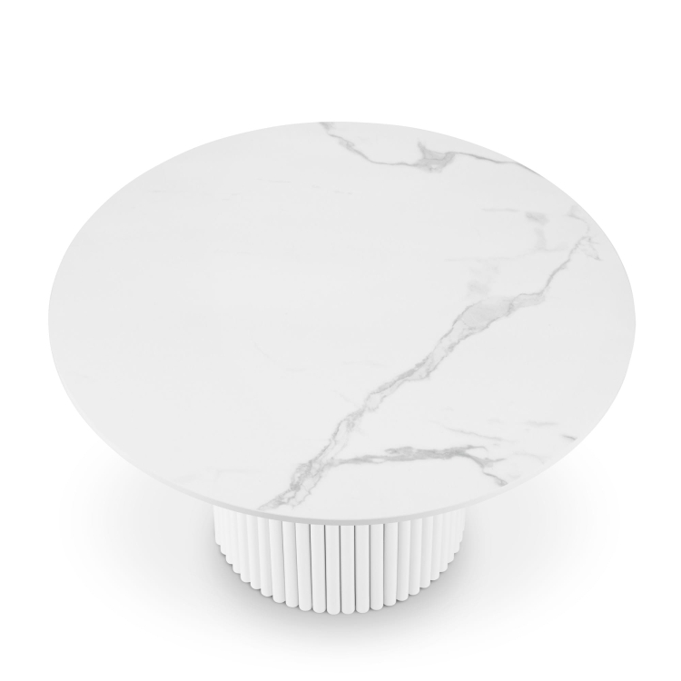 White round table with stone top and grooved base