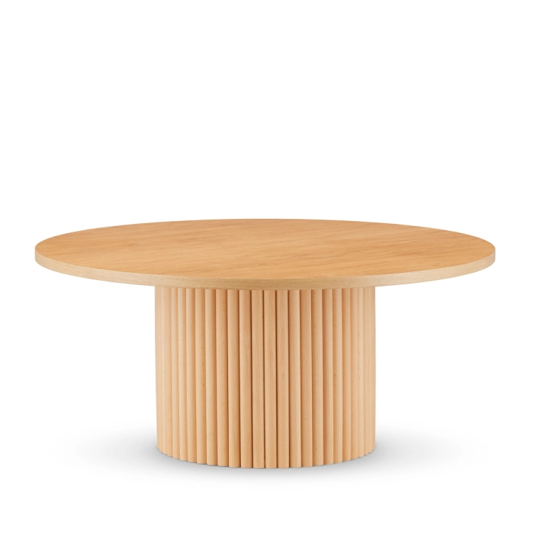 Round wooden coffee table with decorative grooved base
