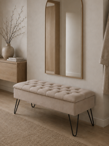Quilted latte pouffe with storage and pin legs, a stylish and modern piece of furniture