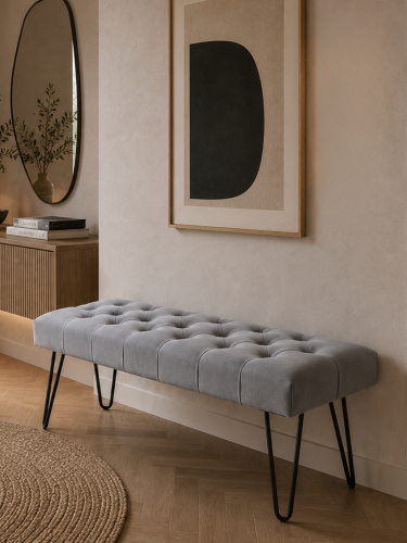 Stylish gray bench with a tufted seat and metal legs