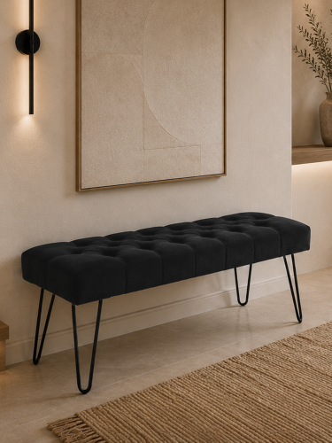 Black quilted bench with pin legs - an elegant and modern piece of furniture for the living room or hallway
