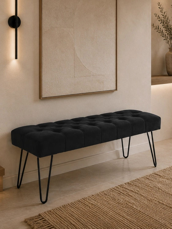 Black quilted bench with pin legs - an elegant and modern piece of furniture for the living room or hallway