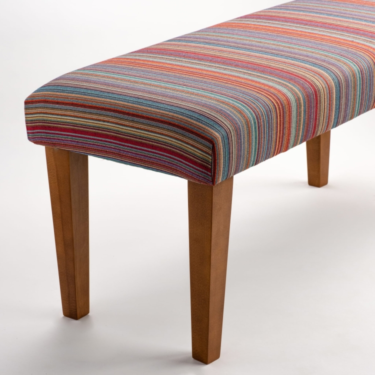 Upholstered striped bench on wooden legs