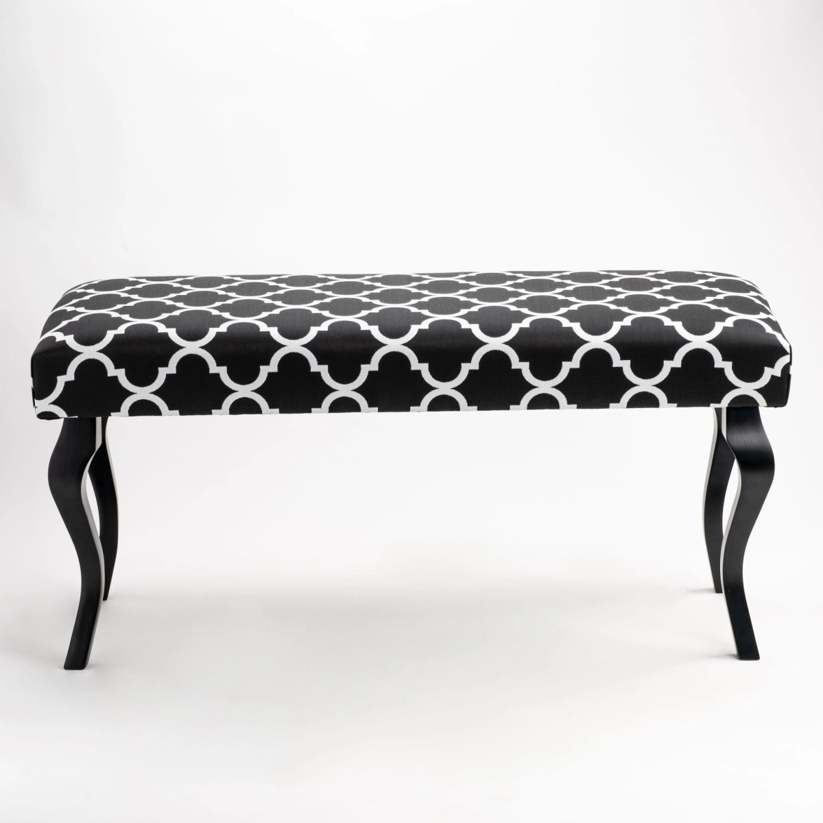 Upholstered bench with colorful pattern and black legs