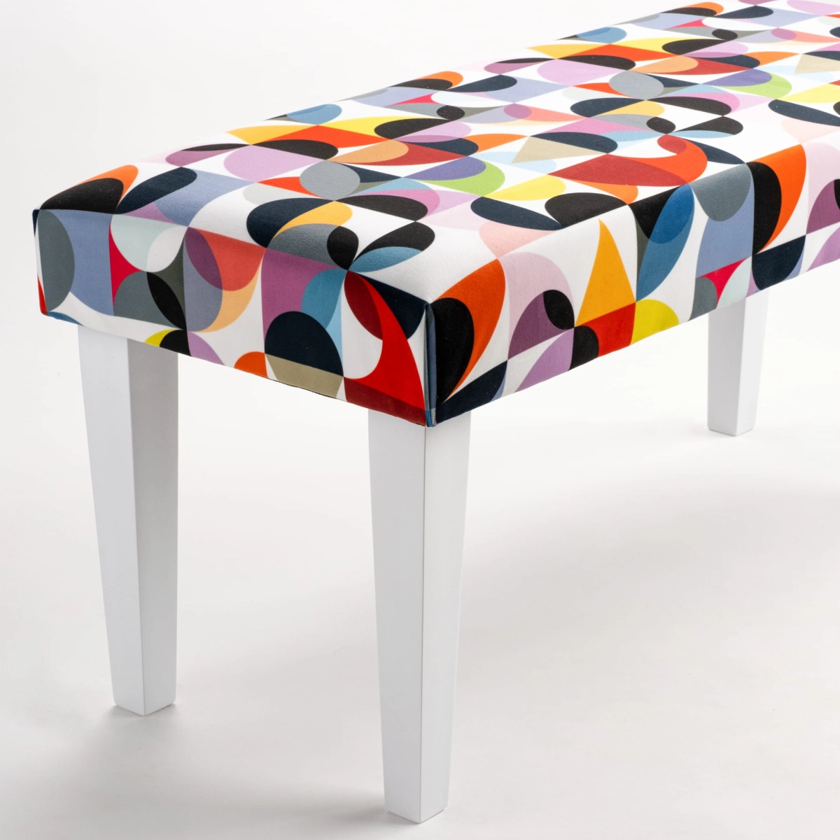 Patterned bench on white legs
