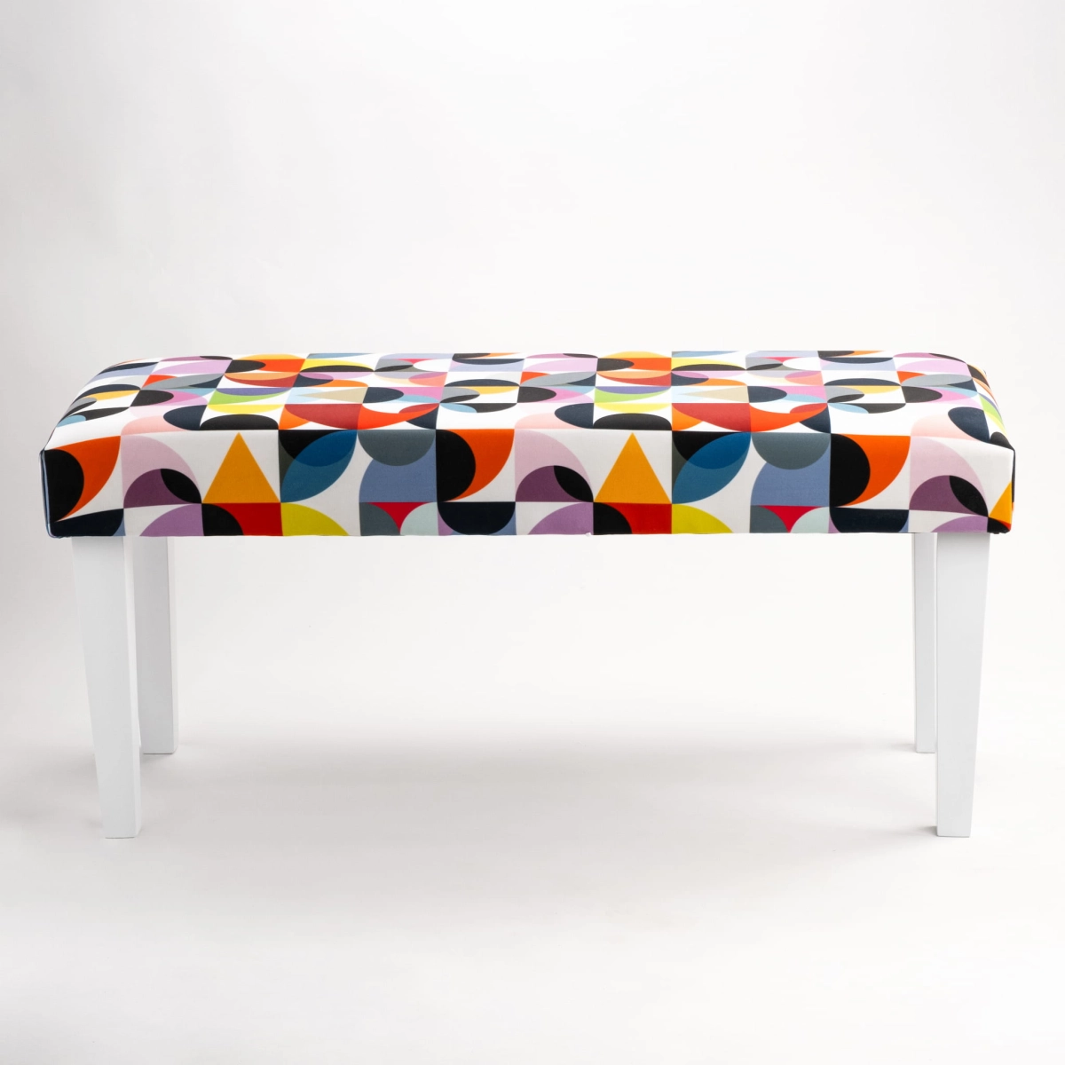Patterned bench on white legs