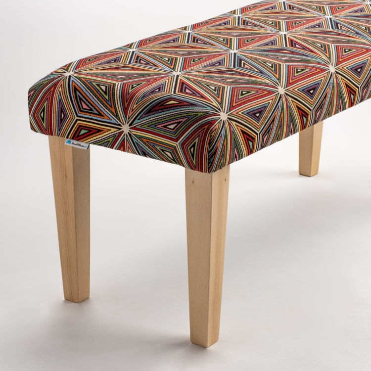 Patterned bench on wooden legs