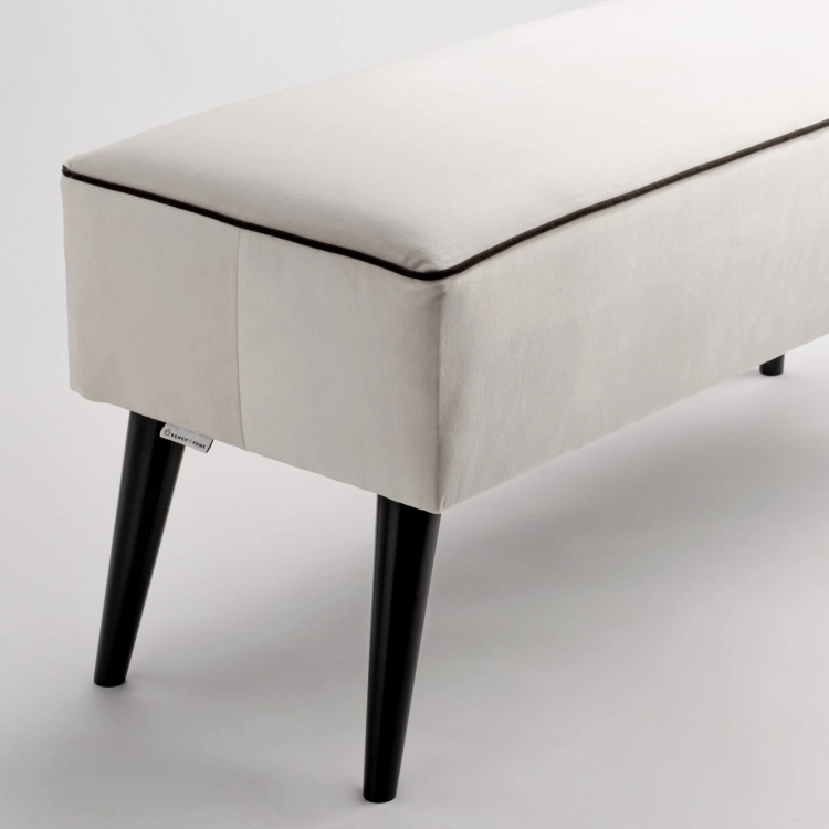 Cream-colored and upholstered bench, perfect for the hallway
