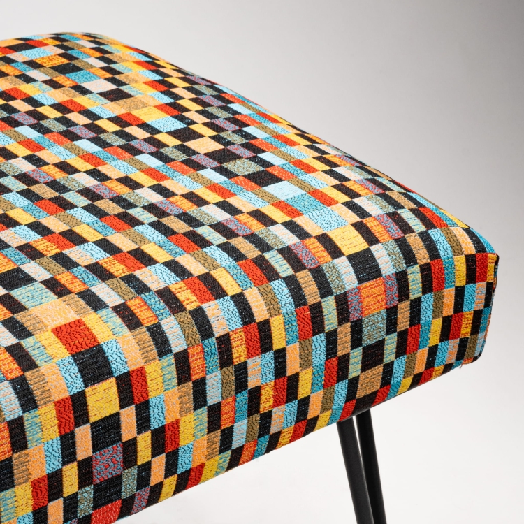 Loft bench with patterned upholstery and black metal pin-shaped base