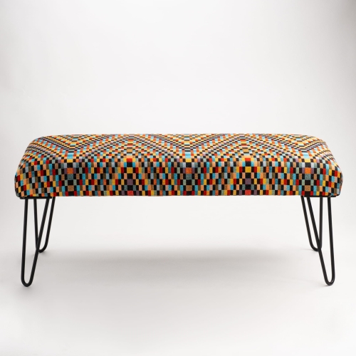 Upholstered industrial bench with colorful pattern and slim pin legs