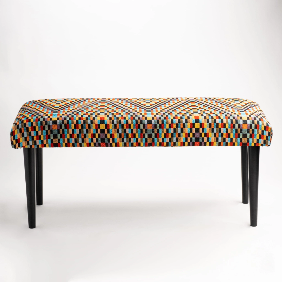 Patterned bench with upholstered seat and black base