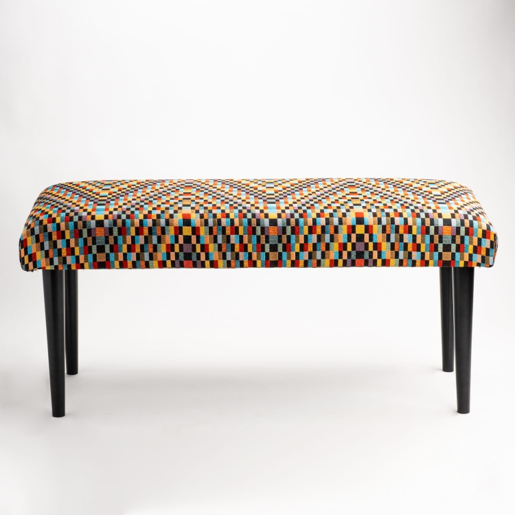 Patterned bench with upholstered seat and black base