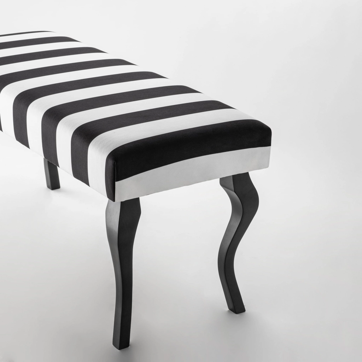 Black and white striped bench with black legs