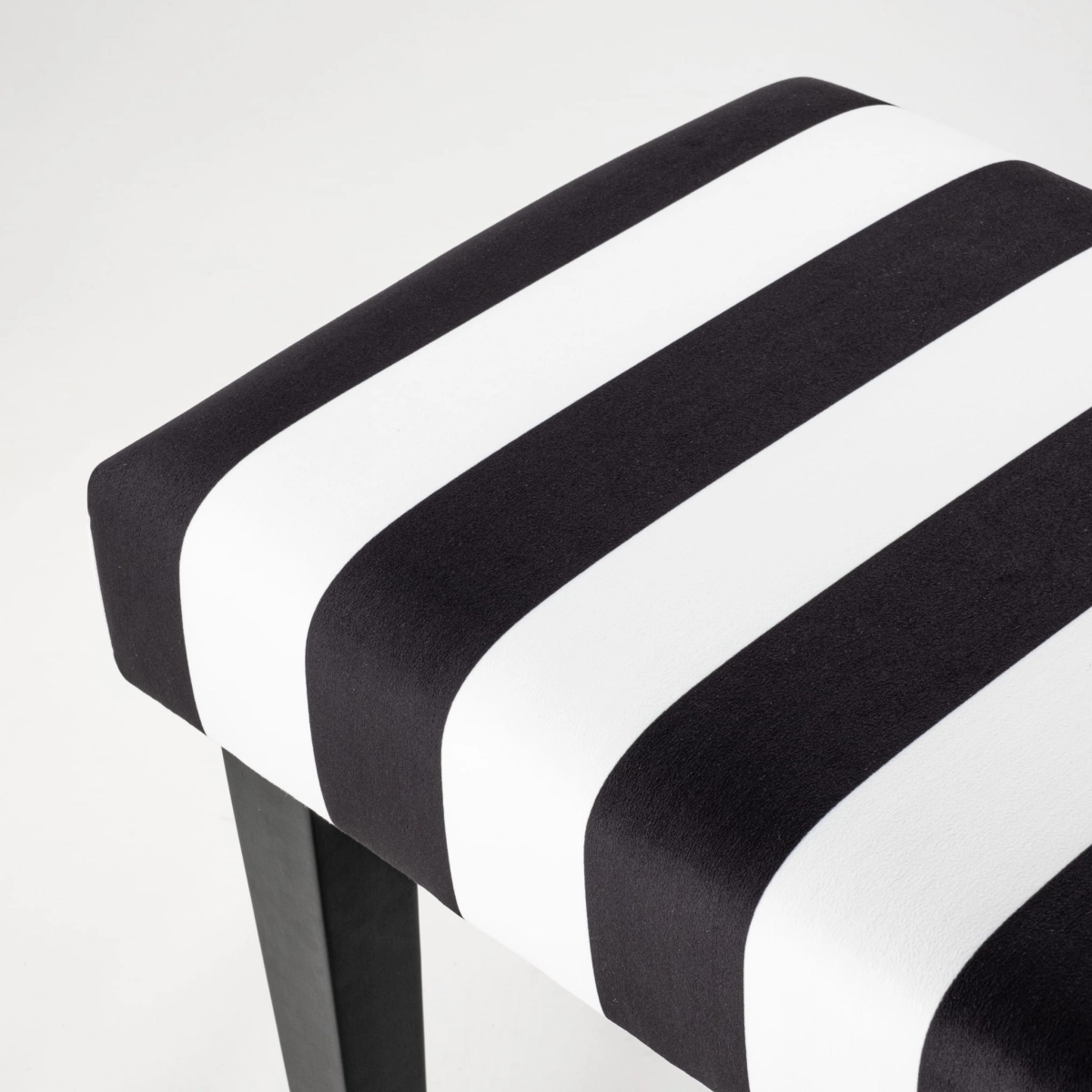 Black and white stripes on the bench