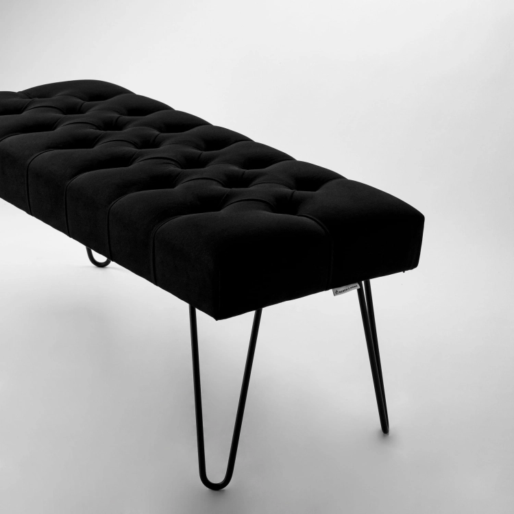 Stylish black tufted bench with metal pin legs