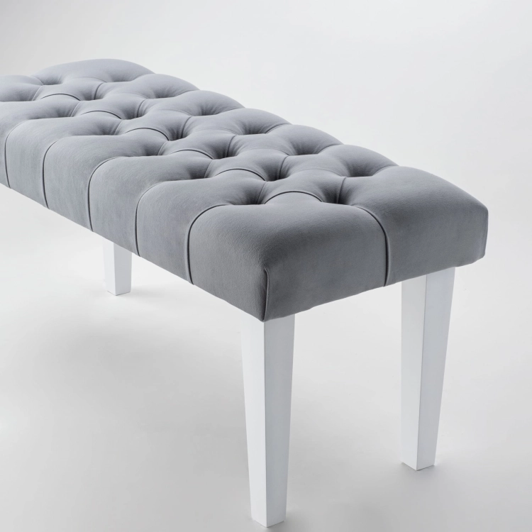Stylish bench in grey with quilted upholstery and white legs