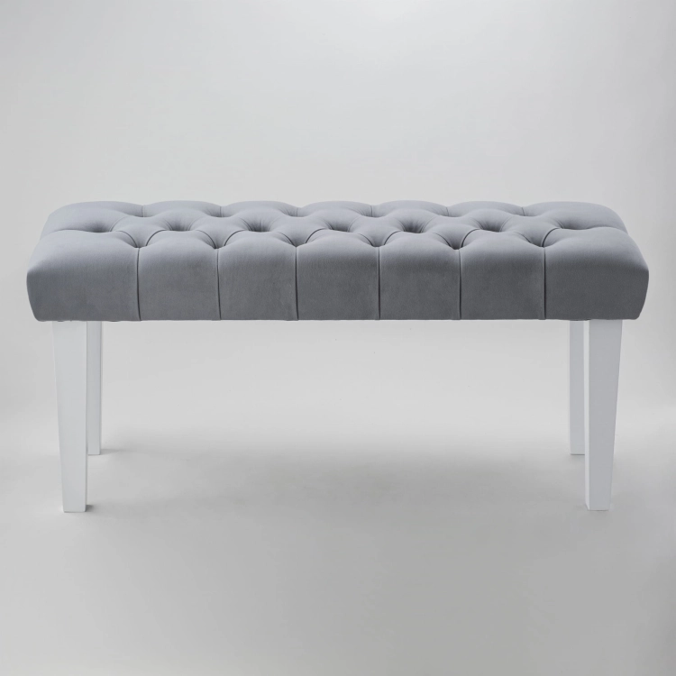 Gray quilted bench with straight white legs