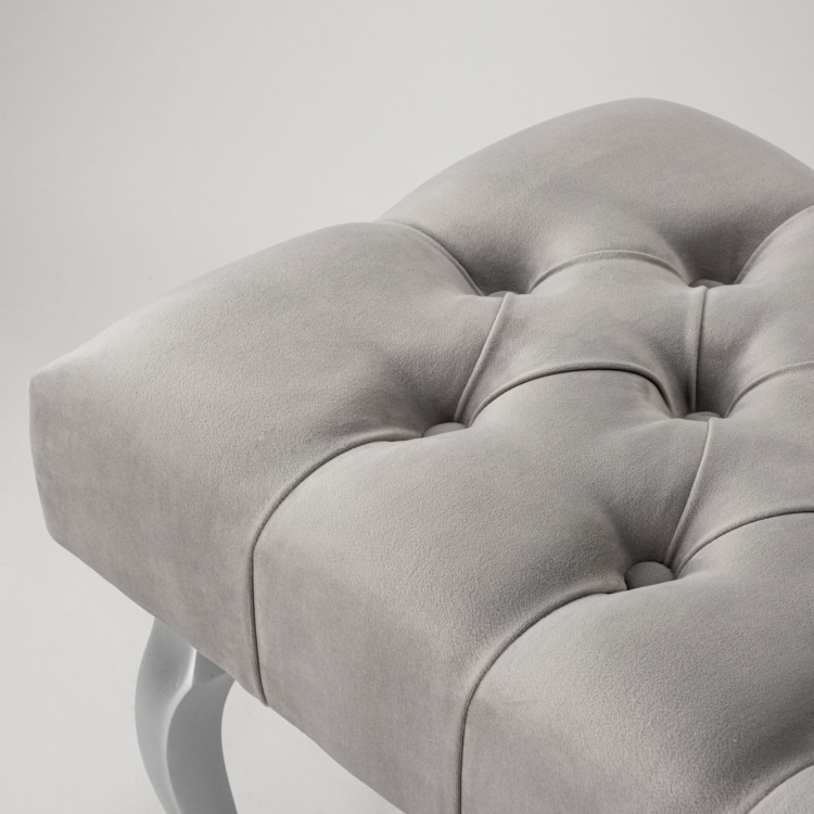 Elegant upholstered grey bench with silver legs