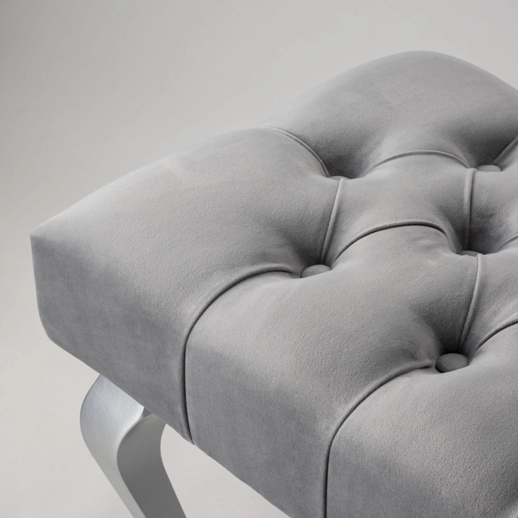 Gray quilted bench with shiny chrome legs