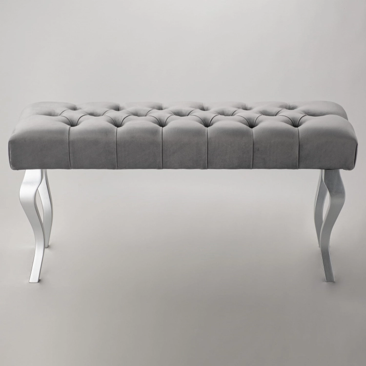 Gray quilted bench with elegant chrome legs