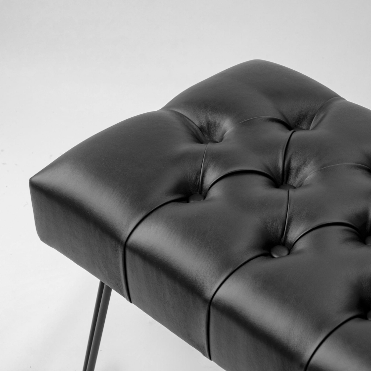 Black leather bench with metal legs in loft style