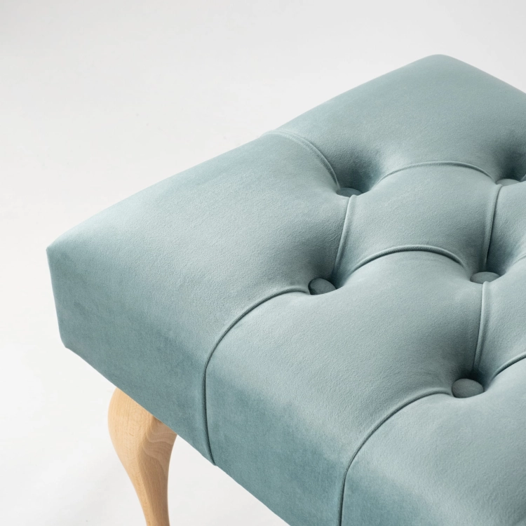 Mint quilted bench with wooden legs a fresh accent to bright, modern interiors