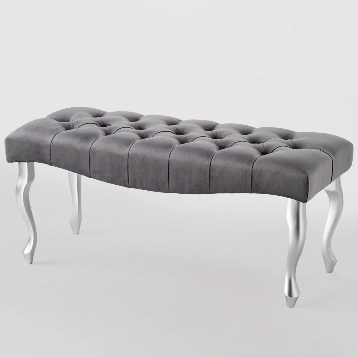 bench with quilted seat and white legs