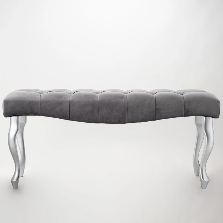 gray bench with a wave-shaped quilted seat