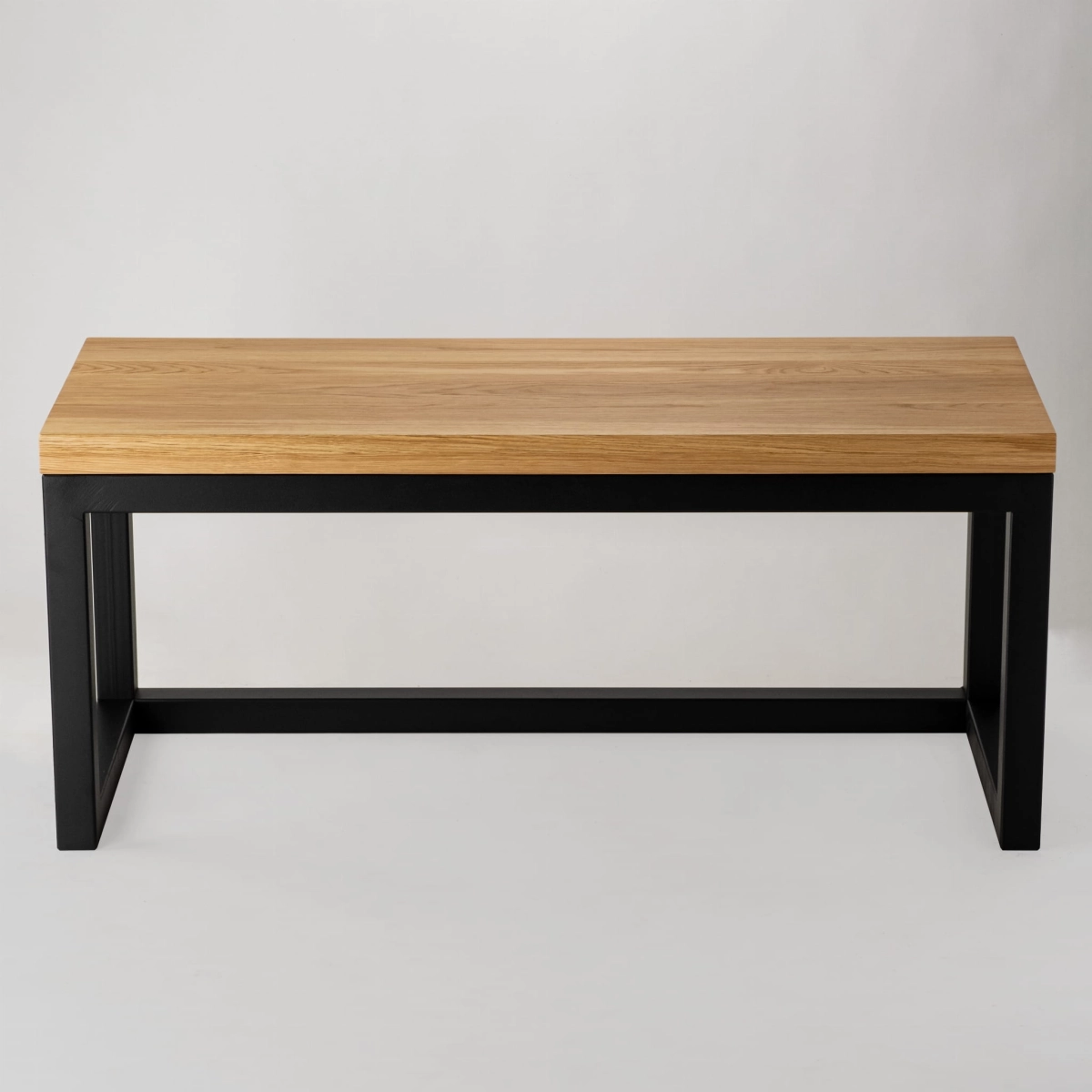 Bench with wooden top and metal frame in industrial style