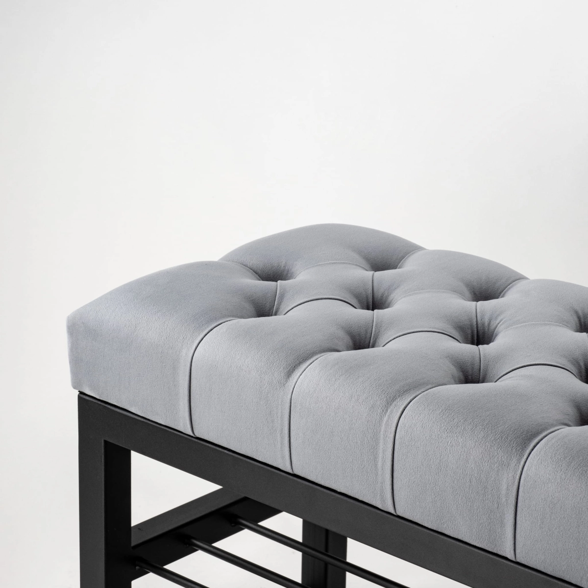grey industrial quilted bench with metal shelves